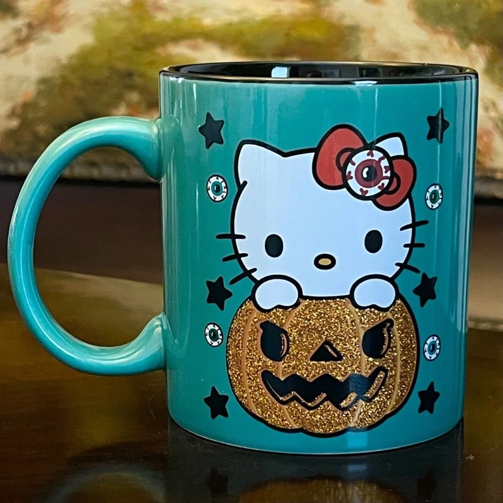 2022 Sanrio Ceramic Halloween Jack-O-Lantern Pumpkin Hello Kitty Teal Mug - NEW - Picture 1 of 2